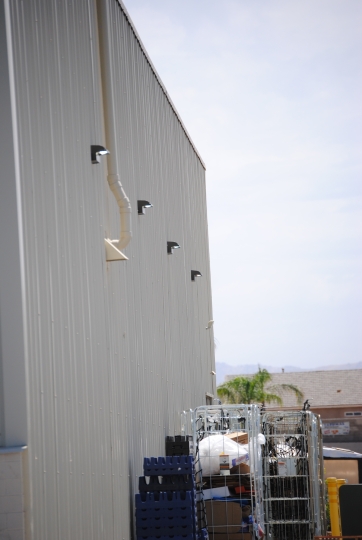 Wall pack lights on the side of a commercial building